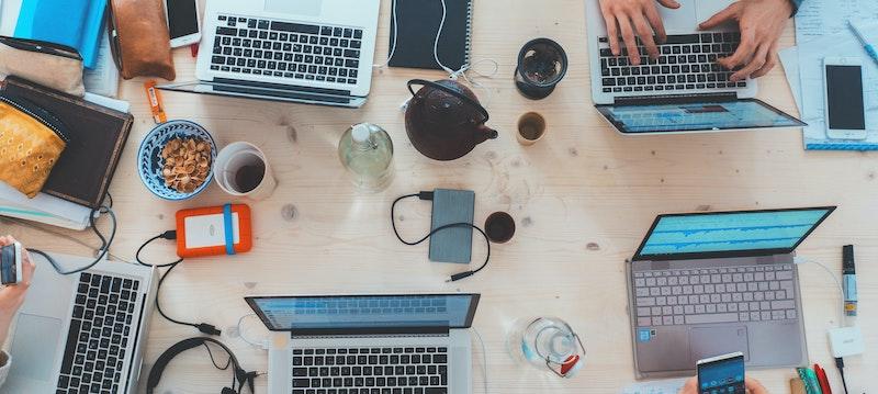 Many laptops on a table